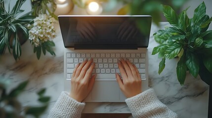 Focused woman worker using laptop computer in office workspace