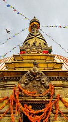 Buddhist Swoyambhu Mahachaitya / Monkey Temple in Kathmandu, Nepal with its large white and golden stupa