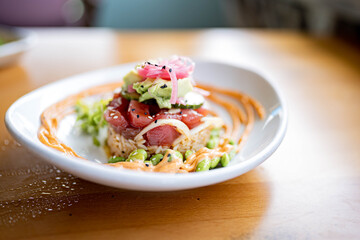 Tuna Poke Rice tower at gourmet beachfront restaurant 