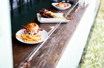 Menu items at gourmet restaurant sitting on bar at the beach