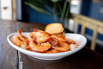 Peel and eat steamed shrimp at beachfront restaurant
