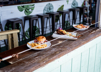 Menu items at gourmet restaurant sitting on bar at the beach