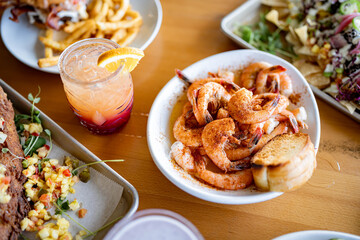 Steamed shrimp with seasoning and toasted bread appetizer with cocktail at seafood restaurant