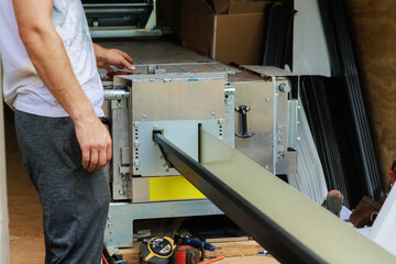 Bending thin metal rain gutters is performed with bending machine