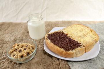 Bread with chocolate choco rice and butter with milk and snack for breakfast	
