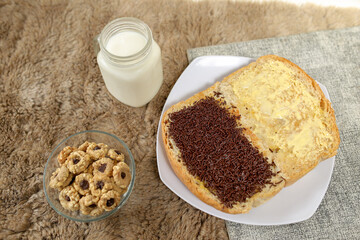 Bread with chocolate choco rice and butter with milk and snack for breakfast	
