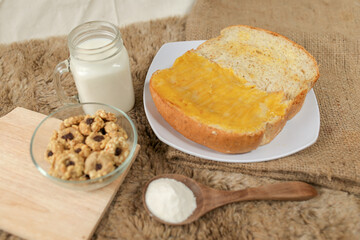 Bread with pineapple jam on a plate for breakfast	
