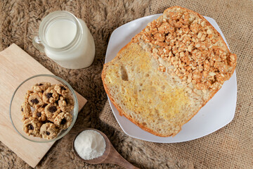 Bread with peanut and butter spread on a table for breakfast	

