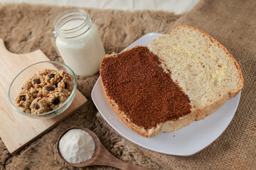 Bread with choco and butter on a plate for breakfast	
