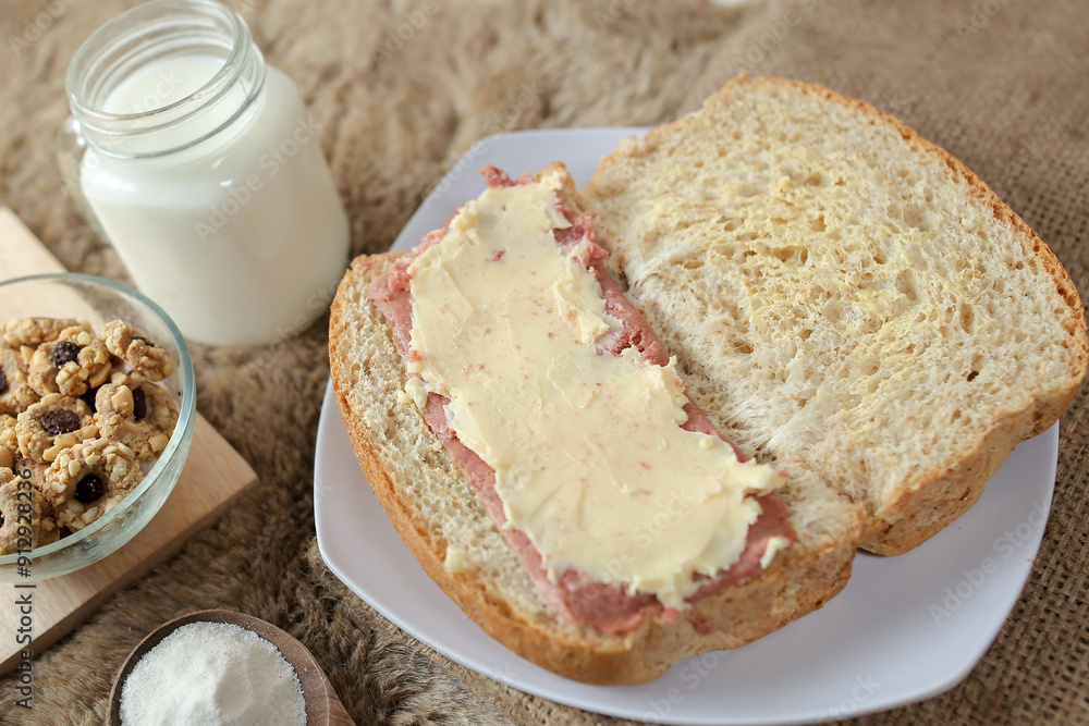 Wall mural bread with smoked beef and mozarella cheese on a plate for fast food breakfast or coffee break.