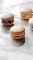 Obraz premium Elegant Assortment of Neutral-Toned Macarons on a Marble Surface. AI-generated