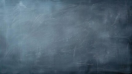 Naklejka premium Dark blue chalkboard background with subtle texture.
