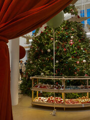 huge Christmas tree and red curtain