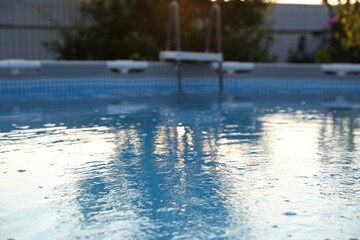 Above ground swimming pool in garden, closeup