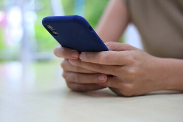 Successful Asian businesswoman sitting at desk working using laptop computer in office. Business and people concept. Businesswoman using laptop computer and working with documents.