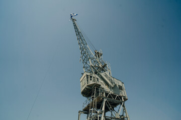 Close up shot of a crane at a harbour.