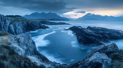 Obraz premium Dramatic Rugged Shoreline with Distant Mountains