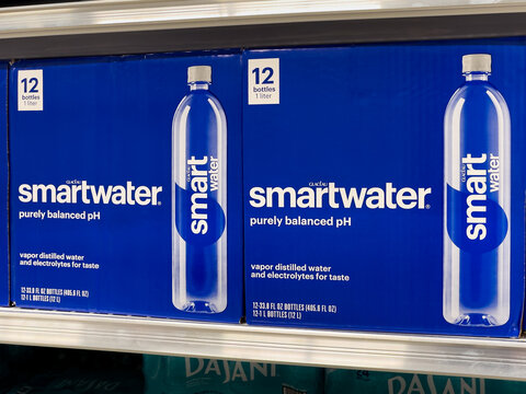 ATLANTA, GEORGIA - AUGUST 7, 2024 : Smartwater bottled water on display in an American grocery store supermarket. Glaceau Smartwater is owned by Energy Brands, a subsidiary of The Coca-Cola Company. 