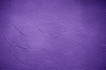 Purple decorative painted plastered wall texture as background