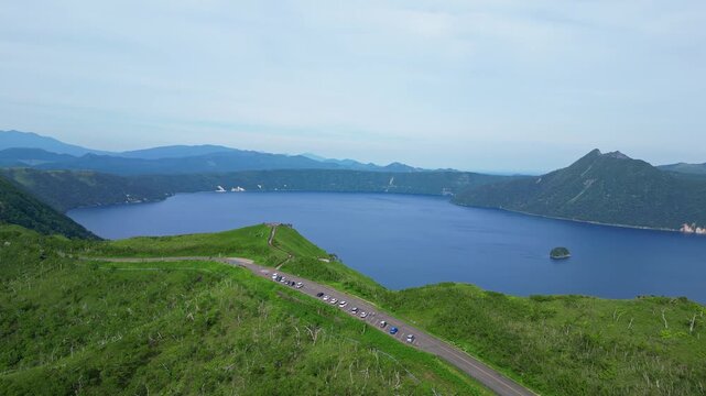 Hokkaido, Japan: Aerial drone footage of the panoramic road and observatory platform along lake Mashu in the Akan-Mashu NP in Hokkaido in summer in Japan. 