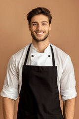 Fototapeta premium Chef uniform mockups with empty copy space to add logos and designs on jackets or high-cuisine uniforms. Handsome Italian Models portraying chef on beige background
