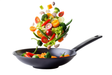 Vegetables fall into a black frying pan on a transparent background. Healthy food concept, The thorny part of the vegetable flying is a beautiful sight