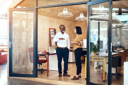 Creative, people and together with conversation in office for project updates, design technique and trends. Graphic designers, team and collaboration with communication, planning and discussion.