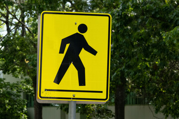 Pedestrian crosswalk warning sign pointing right