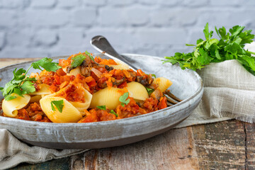 Pasta shells with tomato, mushrooms and chorizo sauce
