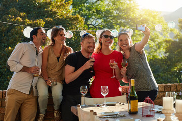Friends, drinks and selfie in backyard, party and happy with conversation, summer and celebration. People, men and woman with toast, alcohol and photography for memory at event in sunshine in Croatia