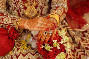 Detailed shot of intricate henna tattoos on a hand 