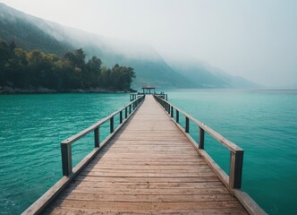 Obraz premium A Beautiful Serene Lake View Featuring a Wooden Pier Set Within a Misty Landscape Scene