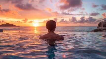 Person enjoying scenic sunset in infinity pool view