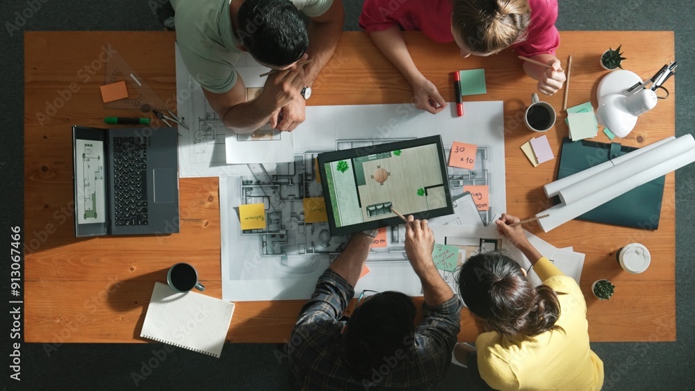 Aufkleber top down view of engineer planning and writing at blueprint. architect team working together to desi