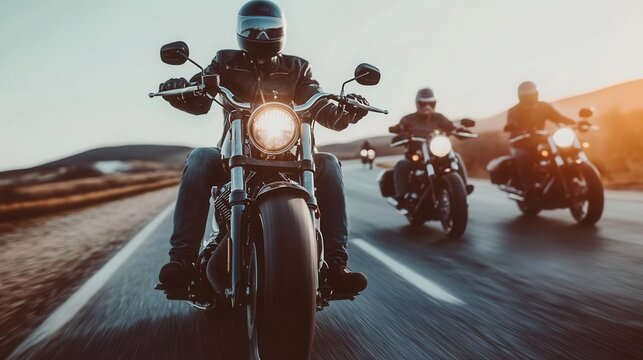 Group of riders on big bikes cruising down a highway, embodying camaraderie and travel