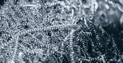 Banner Macro photo of iron metal shavings after CNC drilling lathe machine, Industrial background.