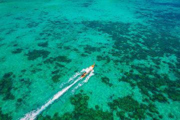 longtail boat turquoise clear water in Phi Phi, Krabi Thailand. Amazing travel landscape photo in Thai
