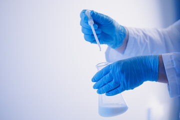Quality control test of milk in laboratory. Dairy factory industry products