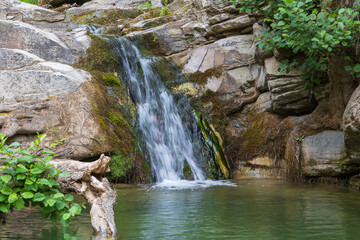 Fototapeta premium Fresh water lake Maries on the island of Thassos Greece - flowing water from the mountains - waterfalls