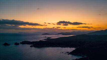Panorama of a Sardinian sunset, fireball instead of the sun in the clouds