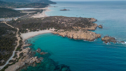 Panorama of a cove in Sardinia, blue and transparent sea at sunset