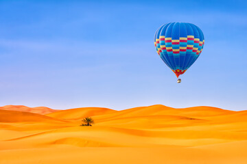 Travel concept. Amazing view of sand dunes with hot air balloons in the Sahara Desert. Location: Sahara Desert, Morocco. Artistic picture. Beauty world.