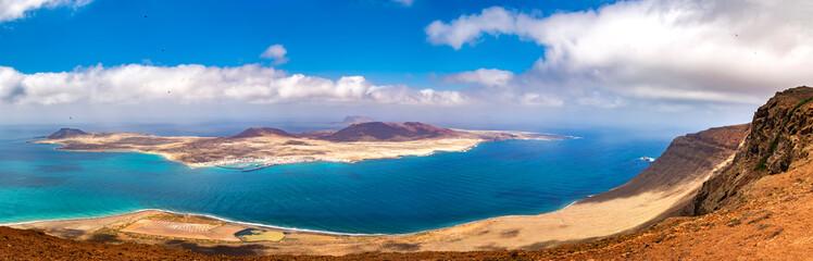 Amazing view of beautiful volcanic island Graciosa - panoramic view near Mirador del rio, Lanzarote. Location: north of Lanzarote, Canary Islands, Spain. Beauty world. Travel concept.