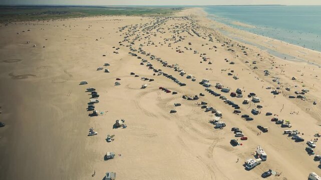 Campers on the sandy beach of Romo Island in Denmark. 