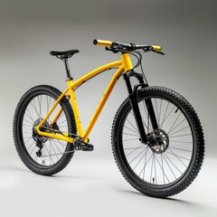 Fototapeta premium Yellow and black 29er mountain bike with thick off-road tires, designed for cross-country