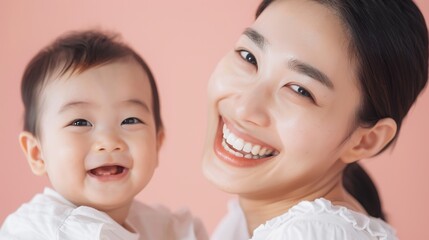 Endearing portrait of an Asian mother and her content baby, highlighting their loving connection and joyful expressions.