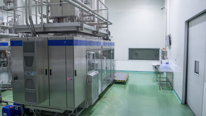 Modern industrial warehouse with high-tech equipment and clean facilities, featuring advanced machinery and organized workspace.