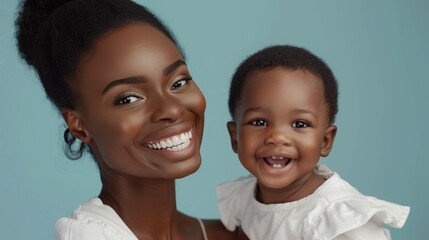Studio image of a woman and her delighted baby, radiating love and connection in a light and airy setting.