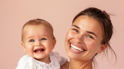 The strong connection between a mother and her smiling baby is showcased in a serene studio.