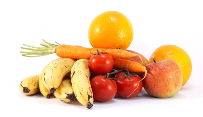 fresh organic vegetables and fruits, bananas and carrots and oranges and tomatoes and apples